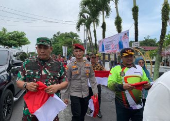 Menyambut Hari  Kemerdekaan RI ke 79 Kapolsekta Kisaran bersama Forkofimcam adakan Pembagian Bendera Merah Putih